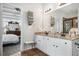 Bathroom with double sinks, a shower, and a view into the main bedroom at 330 Abbey Ct, Canton, GA 30115
