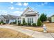 Attractive home exterior featuring manicured bushes, siding and neatly kept lawn at 330 Abbey Ct, Canton, GA 30115