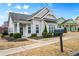Inviting single-story home showcasing a well-kept lawn, a mailbox, and beautiful landscaping at 330 Abbey Ct, Canton, GA 30115