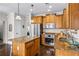 Well-equipped kitchen featuring granite countertops, stainless steel appliances, and an island at 330 Abbey Ct, Canton, GA 30115