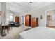 Bright main bedroom featuring neutral walls, carpeted floors, and ample natural light at 330 Abbey Ct, Canton, GA 30115