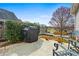 Outdoor patio with grill, seating, and beautiful landscaping, perfect for entertaining at 330 Abbey Ct, Canton, GA 30115