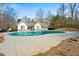 Community pool with a pool house and covered for the off-season at 330 Abbey Ct, Canton, GA 30115