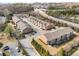 Community aerial view highlighting the layout of townhomes, landscaping, and parking areas at 2286 Emerald Sky Dr, Smyrna, GA 30080