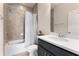 Well-lit bathroom showcasing a vanity, a shower with tile surround and tub, and a modern toilet at 2286 Emerald Sky Dr, Smyrna, GA 30080