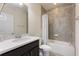 Bathroom features shower-tub combo with gray tile surround, white vanity and hardware at 2286 Emerald Sky Dr, Smyrna, GA 30080