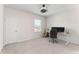 Bedroom with a ceiling fan and a window next to a desk with computer and a guitar at 2286 Emerald Sky Dr, Smyrna, GA 30080