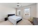 A bedroom with two windows, a bed, carpet and a ceiling fan at 2286 Emerald Sky Dr, Smyrna, GA 30080