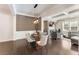 Elegant dining room featuring stylish light fixture, hardwood floors, and a view of the living space at 2286 Emerald Sky Dr, Smyrna, GA 30080
