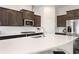 Well-appointed kitchen with stainless steel appliances, white subway tile backsplash, and dark cabinets at 2286 Emerald Sky Dr, Smyrna, GA 30080