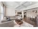 Open-concept living room with a fireplace, modern decor, and hardwood floors at 2286 Emerald Sky Dr, Smyrna, GA 30080