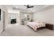 Spacious main bedroom featuring a sitting area, a ceiling fan, and natural light at 2286 Emerald Sky Dr, Smyrna, GA 30080