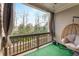 Relaxing patio with a cozy hanging chair and views of the surrounding greenery at 2286 Emerald Sky Dr, Smyrna, GA 30080