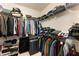 Walk-in closet with metal shelving for clothing and storage including luggage at 2286 Emerald Sky Dr, Smyrna, GA 30080