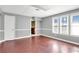 This finished basement features hardwood floors, neutral walls, and natural lighting from a window at 25 Pine Ferry Nw Dr, Kennesaw, GA 30144