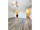 A well-lit room featuring gray wood-look floors and a ceiling fan for added comfort at 2533 Piering Dr, Lithonia, GA 30038
