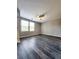 Bedroom featuring wood-look vinyl floors, ceiling fan, and two windows at 2533 Piering Dr, Lithonia, GA 30038