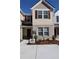 Charming townhome featuring brick and siding exterior, neat landscaping, and a 'For Rent' sign at 2533 Piering Dr, Lithonia, GA 30038