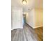 Inviting entryway featuring modern gray plank flooring, neutral paint, and a view down the hall at 2533 Piering Dr, Lithonia, GA 30038