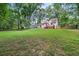 Large backyard with trees and plenty of space for outdoor recreation at 277 Hope Dr, Dallas, GA 30157