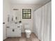 Bathroom featuring a vanity, sink, toilet, window and a shower with a curtain at 277 Hope Dr, Dallas, GA 30157