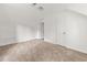 Neutral bedroom features carpeted floors, white walls, closet and access to other rooms at 277 Hope Dr, Dallas, GA 30157
