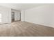 An open bedroom with neutral carpet, a closet, and an adjoining bathroom at 277 Hope Dr, Dallas, GA 30157