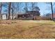 Rear exterior of home with wooden siding and a spacious backyard at 277 Hope Dr, Dallas, GA 30157
