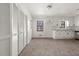 Bright kitchen with white cabinetry, modern hardware, and ample storage space with tile floors at 277 Hope Dr, Dallas, GA 30157