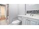 Cozy bathroom with a tiled floor and shower with a large vanity at 256 Olde Oaks Ln, Riverdale, GA 30274