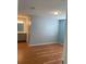 Spacious bedroom with wood-look floors and attached bathroom at 256 Olde Oaks Ln, Riverdale, GA 30274