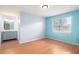 Bright bedroom with laminate floors, a large window and ensuite bathroom at 256 Olde Oaks Ln, Riverdale, GA 30274