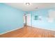 Bright bedroom with wood-look floors, light blue walls and ample natural light at 256 Olde Oaks Ln, Riverdale, GA 30274