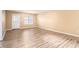Bright living room features new flooring, large window, and neutral paint at 256 Olde Oaks Ln, Riverdale, GA 30274