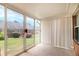 Bright sunroom featuring full wall of windows with exterior garden view at 256 Olde Oaks Ln, Riverdale, GA 30274