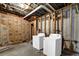 Unfinished basement features a washer and dryer hookup and exposed ceiling and framing at 3608 Stedman Pl, Duluth, GA 30096