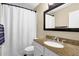 Bathroom features a granite countertop, a large mirror and a shower with a white curtain at 3608 Stedman Pl, Duluth, GA 30096