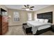 Comfortable bedroom with a modern headboard, plush carpet and a ceiling fan for added comfort at 3608 Stedman Pl, Duluth, GA 30096
