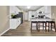 Well-lit kitchen features white cabinets, granite countertops, stainless steel appliances, and a convenient breakfast bar at 3608 Stedman Pl, Duluth, GA 30096