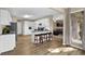 Open kitchen features white cabinets, stainless steel appliances, granite countertops, and a breakfast bar overlooking the living room at 3608 Stedman Pl, Duluth, GA 30096
