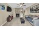 Comfortable living room featuring fireplace, ceiling fan, and cozy seating arrangement at 3608 Stedman Pl, Duluth, GA 30096