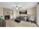 Cozy living room featuring a brick fireplace, ceiling fan, and comfortable seating at 3608 Stedman Pl, Duluth, GA 30096