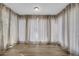 Bright sunroom featuring large windows with lovely views and hardwood flooring at 3608 Stedman Pl, Duluth, GA 30096