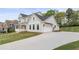 Well maintained home boasts a long driveway leading to an attached two car garage at 4060 Andover Cir, Mcdonough, GA 30252