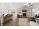 Open concept living room featuring a fireplace, and an island with barstool seating at 4060 Andover Cir, Mcdonough, GA 30252