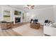 Bright living room with a fireplace, comfortable seating, and ample natural light at 4060 Andover Cir, Mcdonough, GA 30252