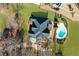 Birds eye view of waterfront property with in-ground pool and beautiful landscaping at 770 Huiet Dr, Mcdonough, GA 30252