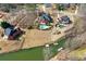Stunning aerial view of luxury homes with pools, waterfront access, and meticulously landscaped yards at 770 Huiet Dr, Mcdonough, GA 30252