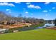 Large backyard with waterfront views, boat docks and lush green landscape at 770 Huiet Dr, Mcdonough, GA 30252