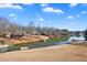 Large backyard with waterfront views, boat docks and lush green landscape at 770 Huiet Dr, Mcdonough, GA 30252
